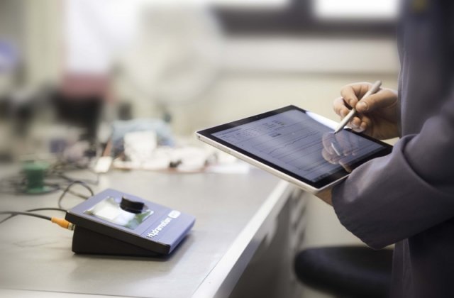 Image of staff using a viscometer with tablet and viscolink graphing software